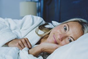 woman lying on bed